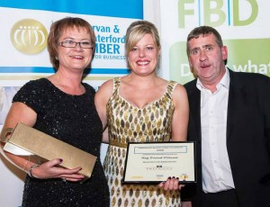 Directors Lucia Quealy and John McGrath from Terra Nua Building Contractors present Mags Durand O'Connor with her Award for Person of the year at the Dungarvan and West Waterford FBD Chamber awards